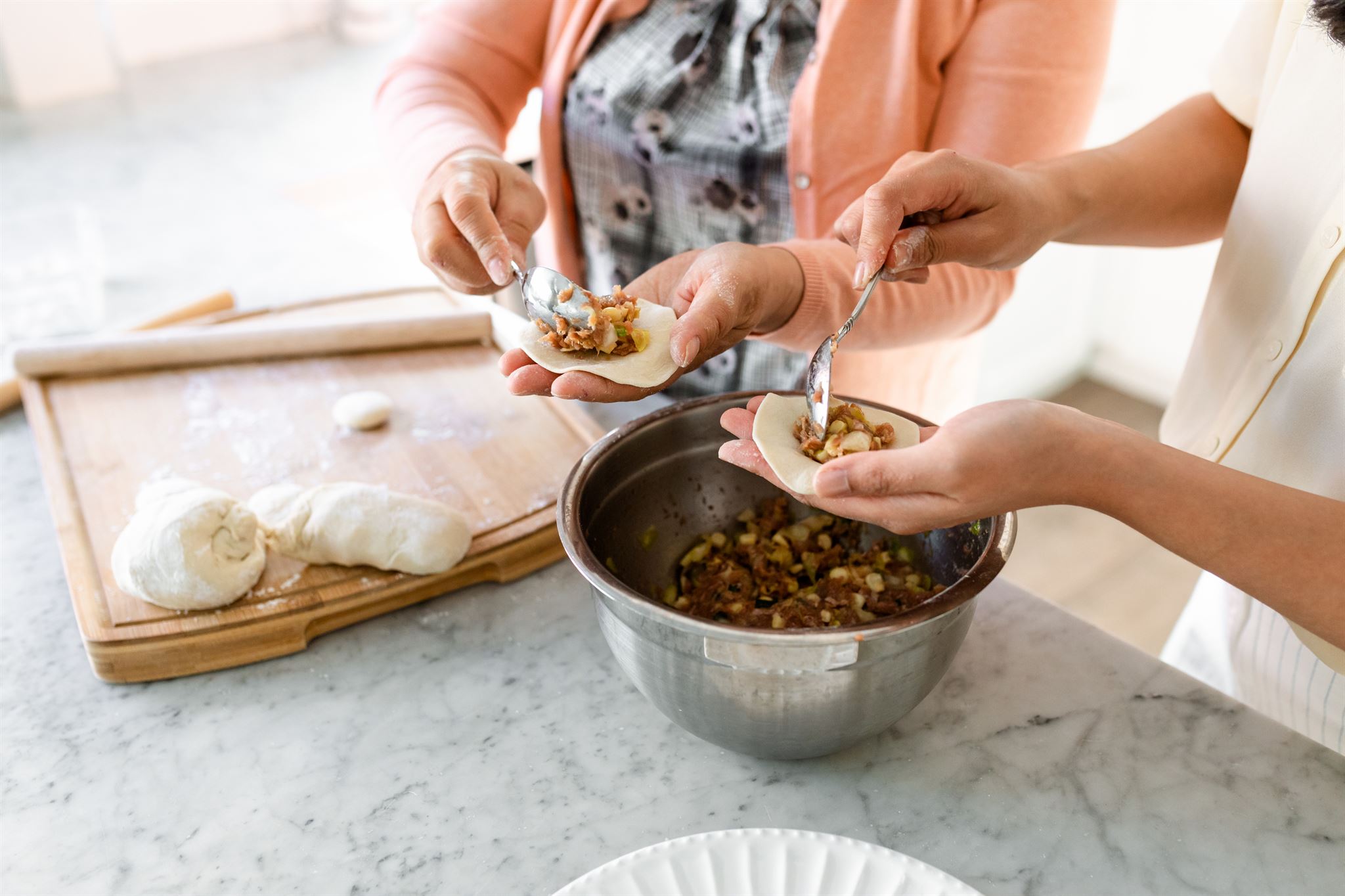 Close-up-of-people-filling-dumplings